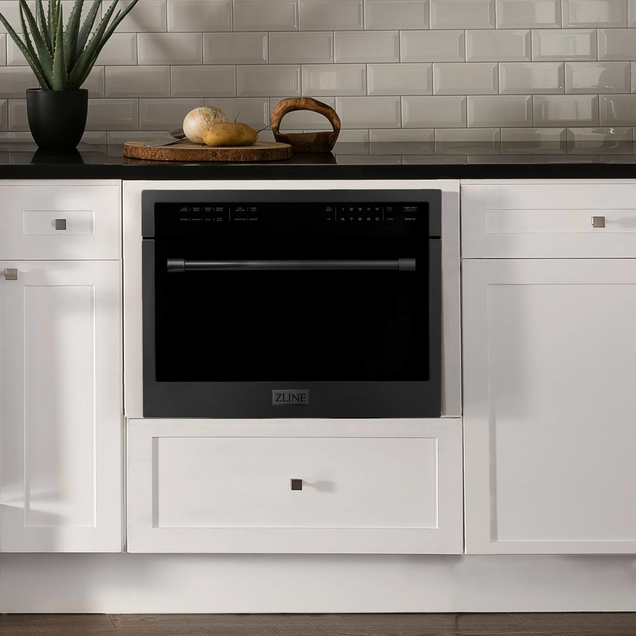 Built-in black oven with control panel and handle, set in cabinetry