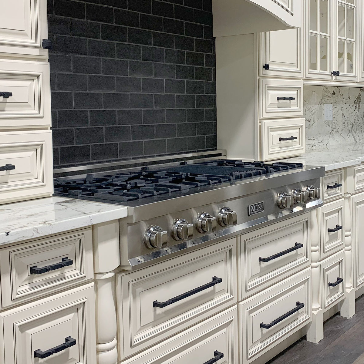 Stainless 48-inch rangetop with black burner grates and control knobs
