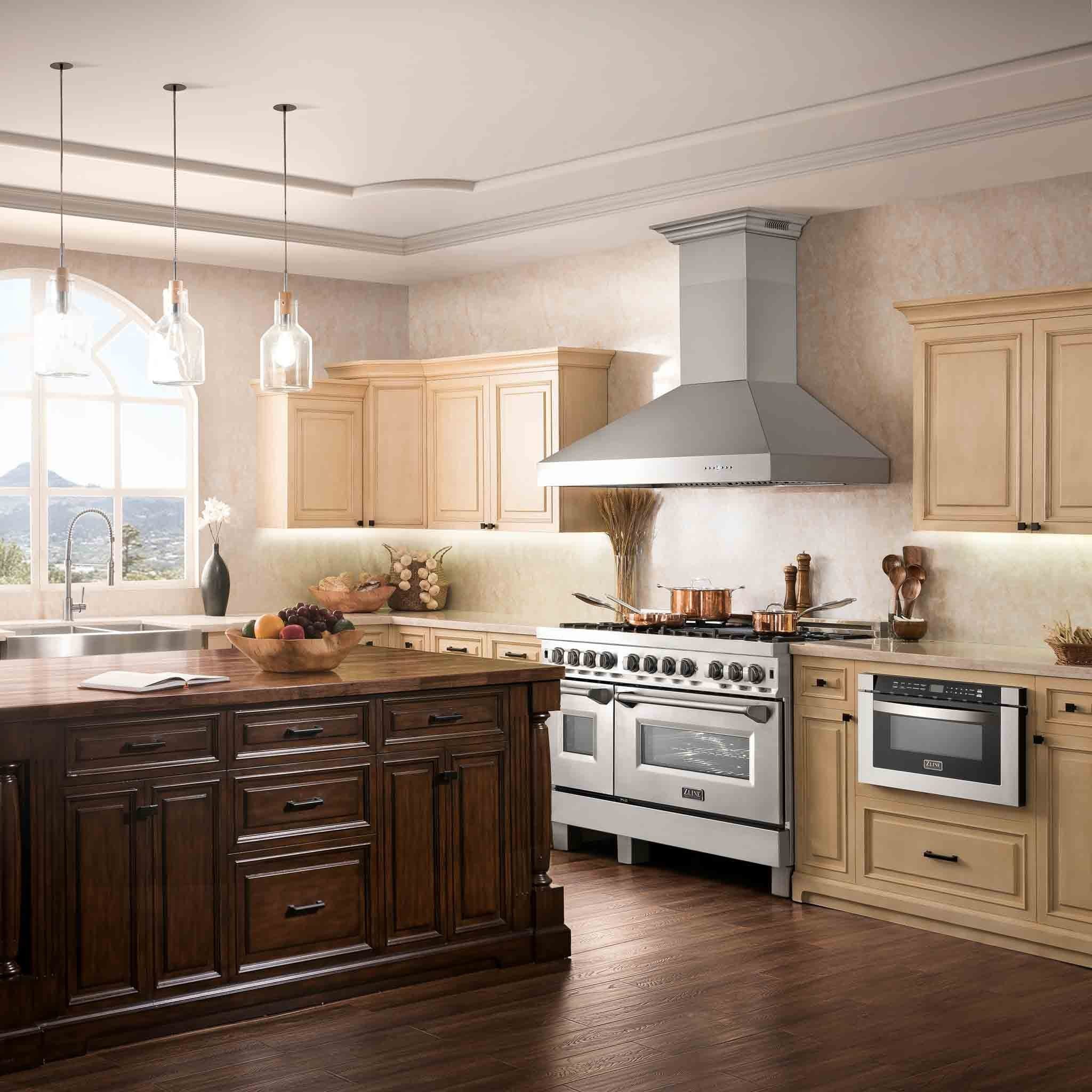 Stainless steel wall mount chimney range hood over a cooking range