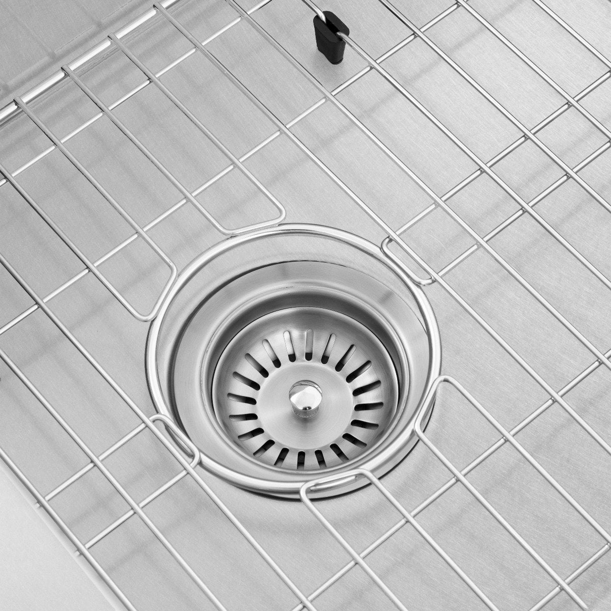 Stainless steel single-bowl kitchen sink drain with circular strainer and bottom grid