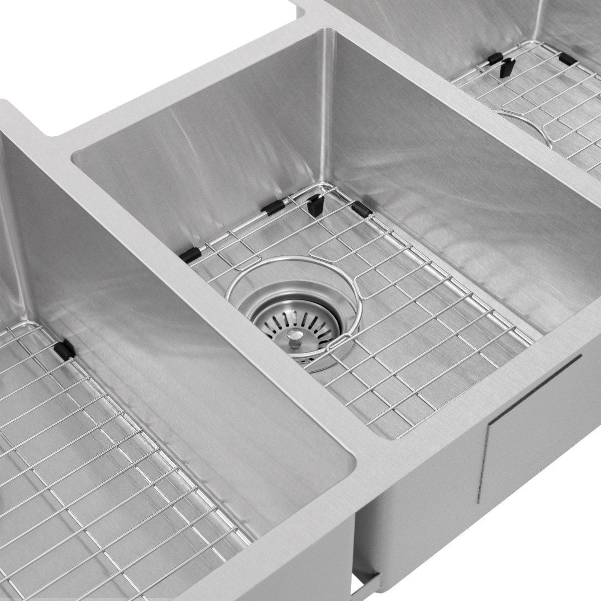Stainless steel sink basin with wire rack and round drain strainer in center