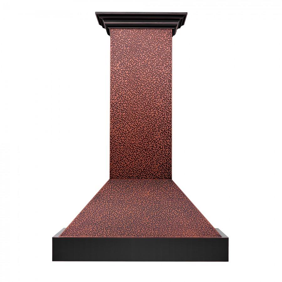 Copper wall range hood chimney with dark underside and flared vent canopy