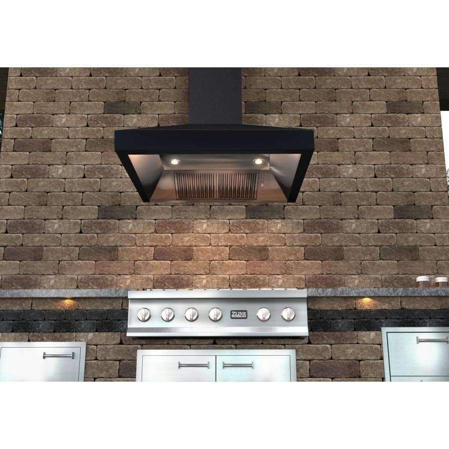 Matte black wall range hood underside with vent grille and two recessed light spots