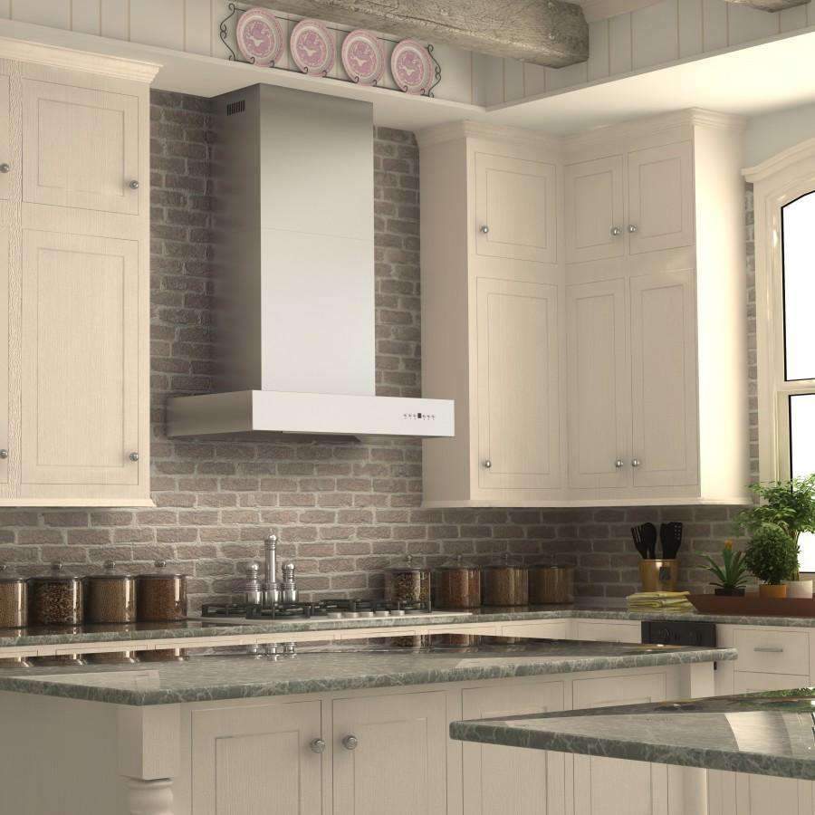 Stainless steel ducted wall mount range hood over gas cooktop