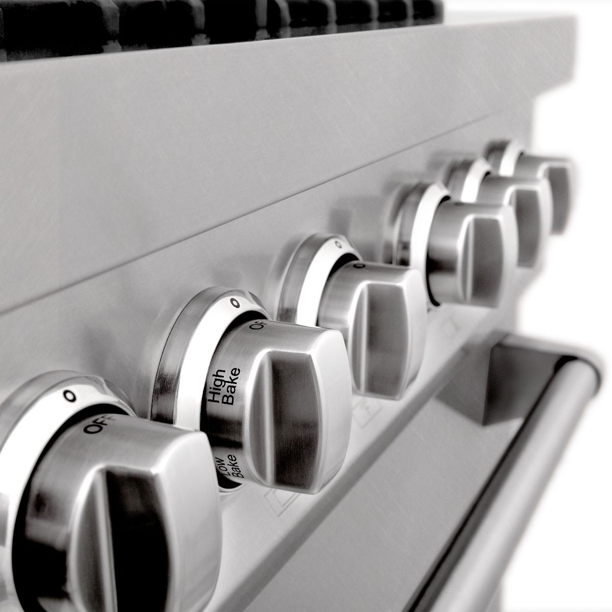 Brushed stainless steel gas range with brass burner accents and control knob detail