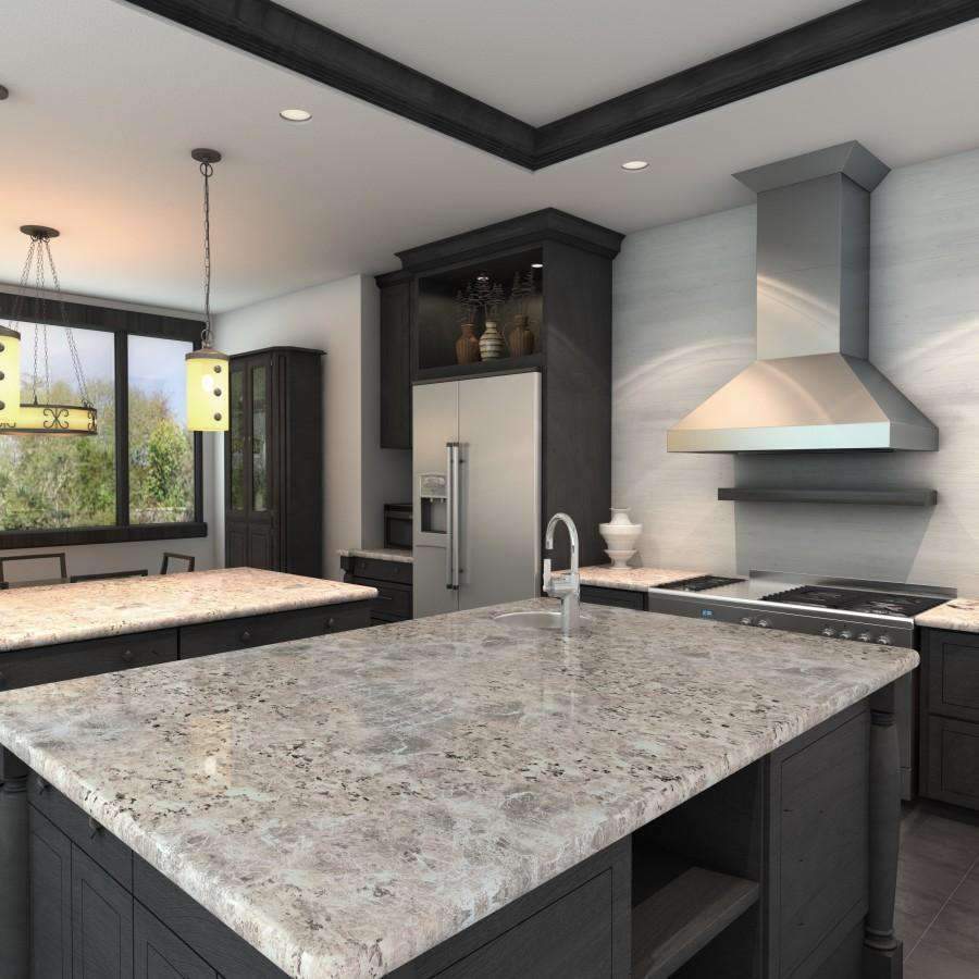 Stainless steel wall-mounted range hood above a cooktop in a modern kitchen.