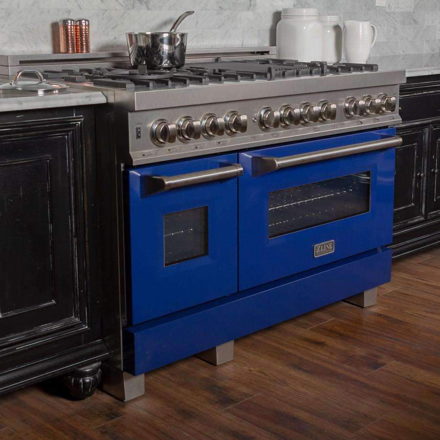 Dual fuel range in blue with stainless knobs and two black glass oven doors