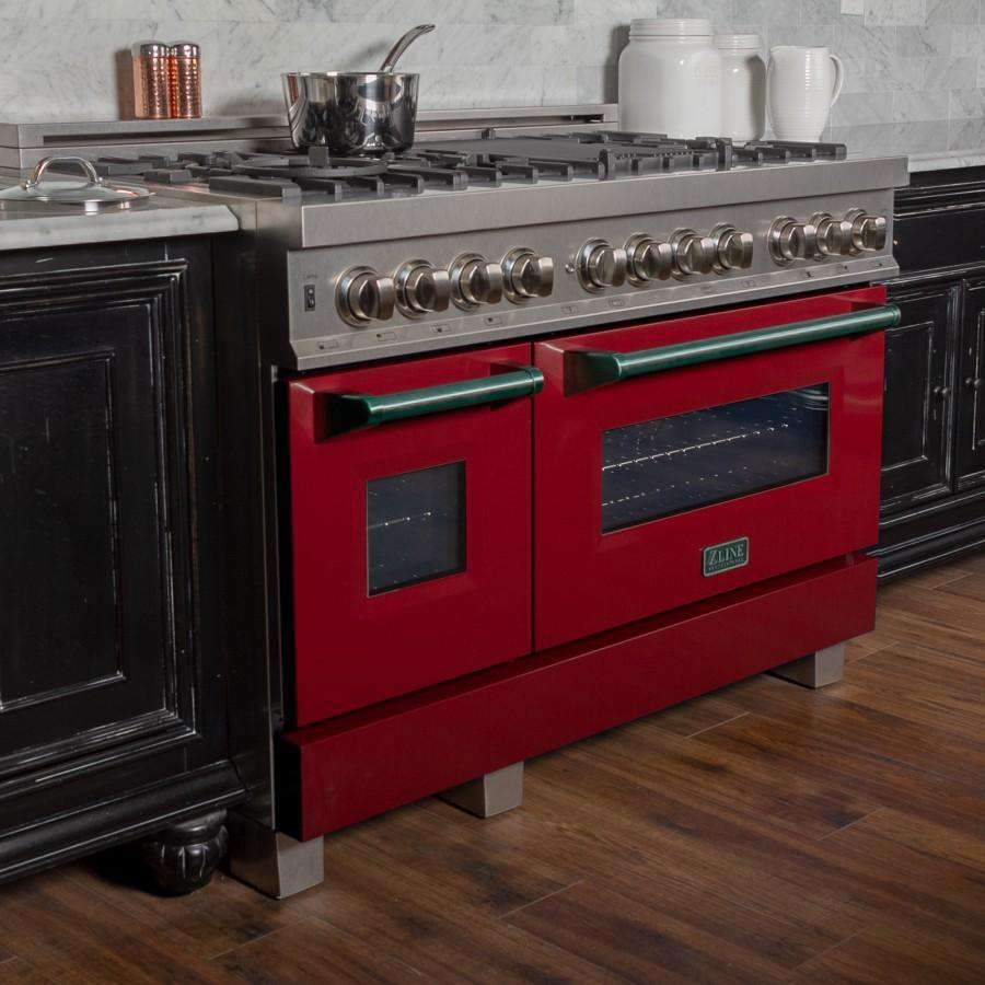 Side view of red glossy dual-fuel range with stainless control panel and two oven doors