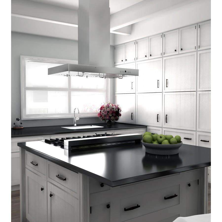 Stainless island range hood centered over black cooktop with vented canopy