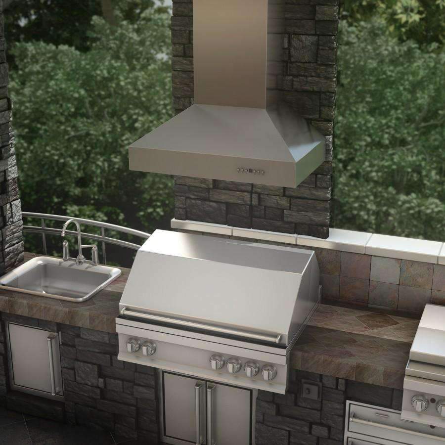 Stainless steel ducted wall mount range hood above outdoor grill, chimney-style vent hood