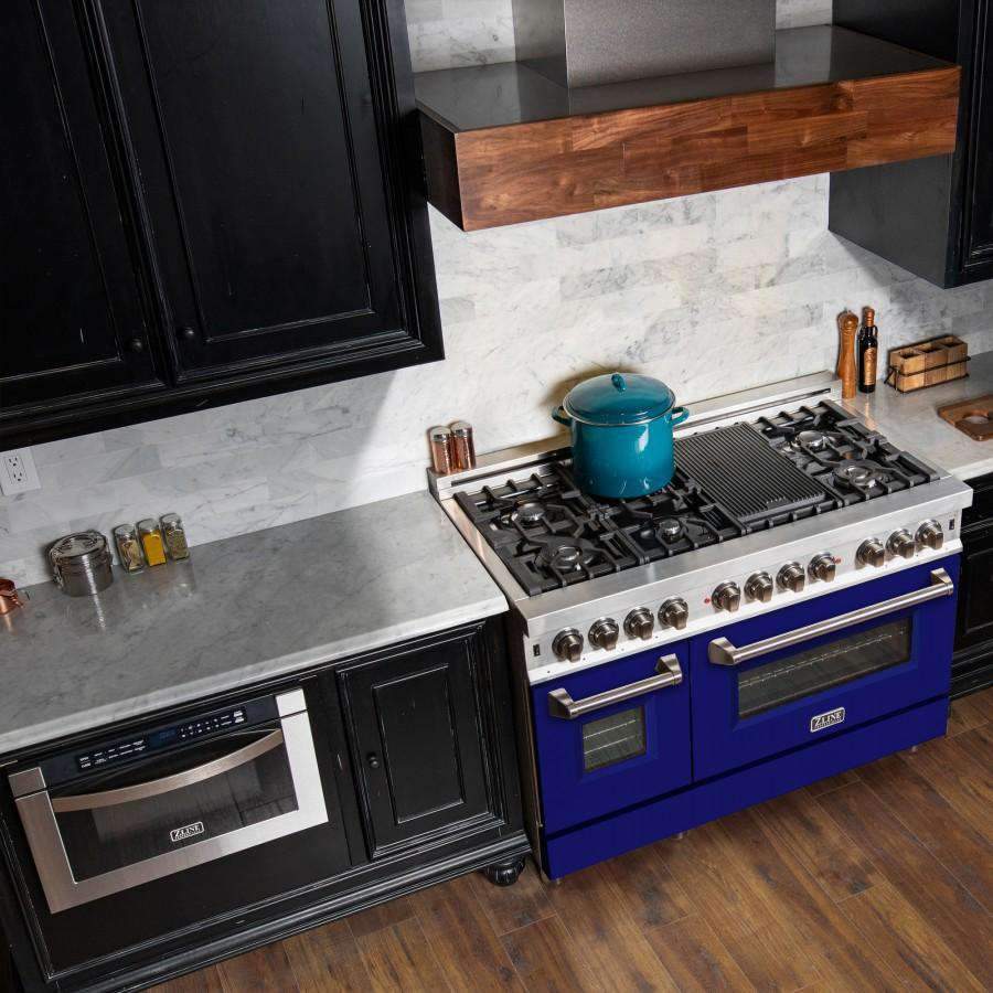 Dual fuel range with blue matte doors, stainless control knobs, and black burner grates
