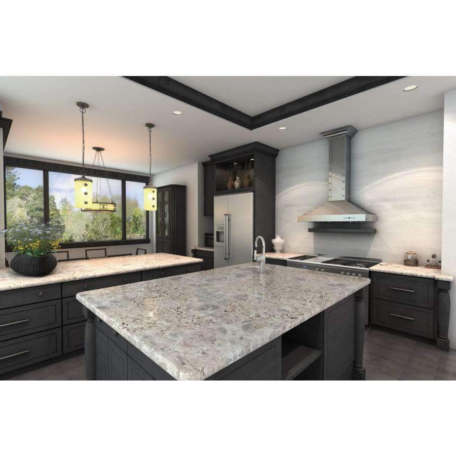Stainless steel wall range hood above a kitchen cooktop