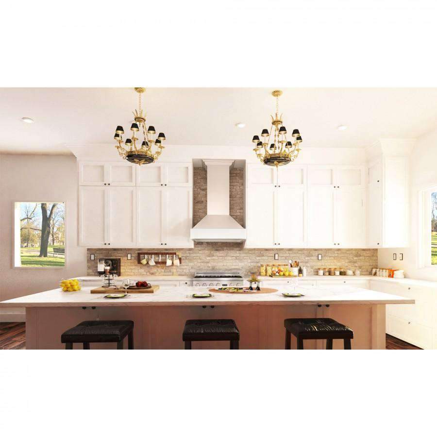 Cottage white wall-mounted range hood centered above the cooktop in a kitchen