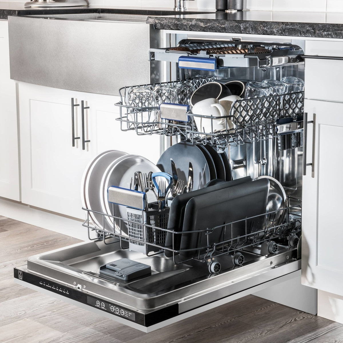 Built-in dishwasher with open door and loaded racks holding plates, bowls, and cups.