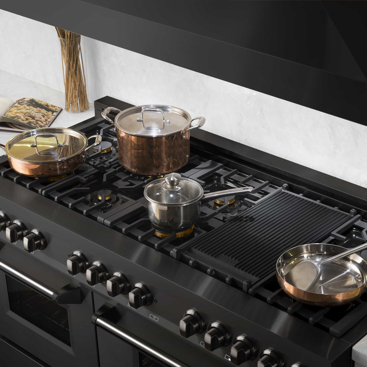 Black range cooktop with grates and multiple gas burners