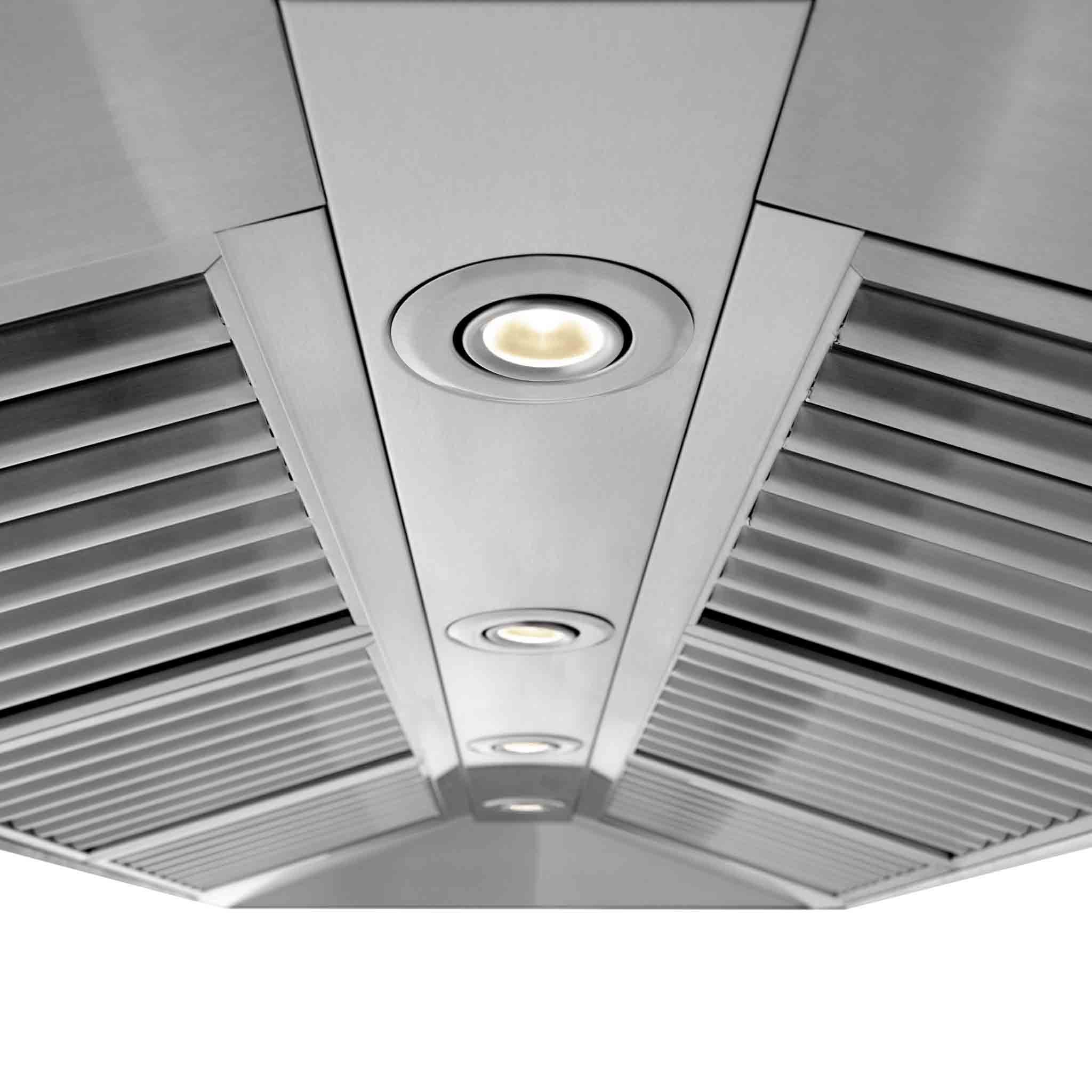 Stainless steel range hood underside with three LED lights and baffle vent channels