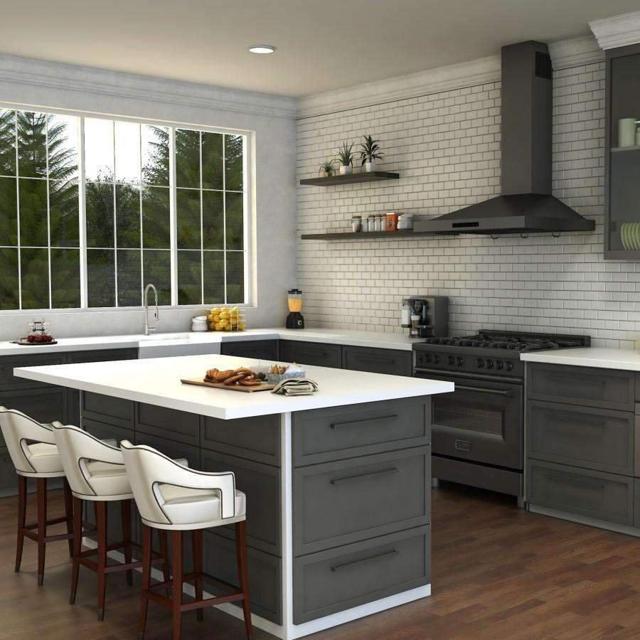 Brushed nickel kitchen faucet with arched neck and pull-down spray head over sink.