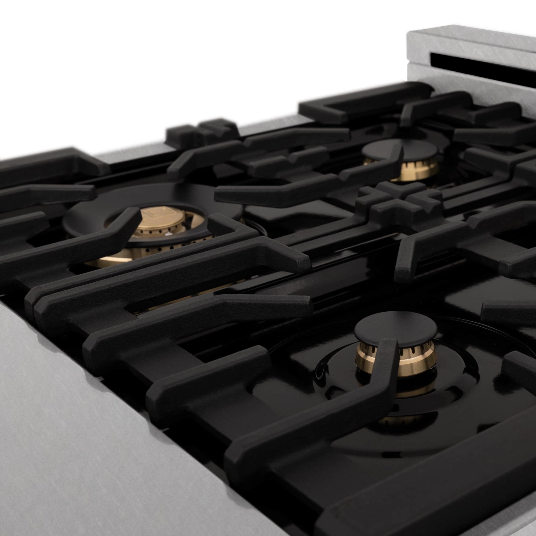Black gas cooktop grate with burner rings and brass-trimmed igniter heads