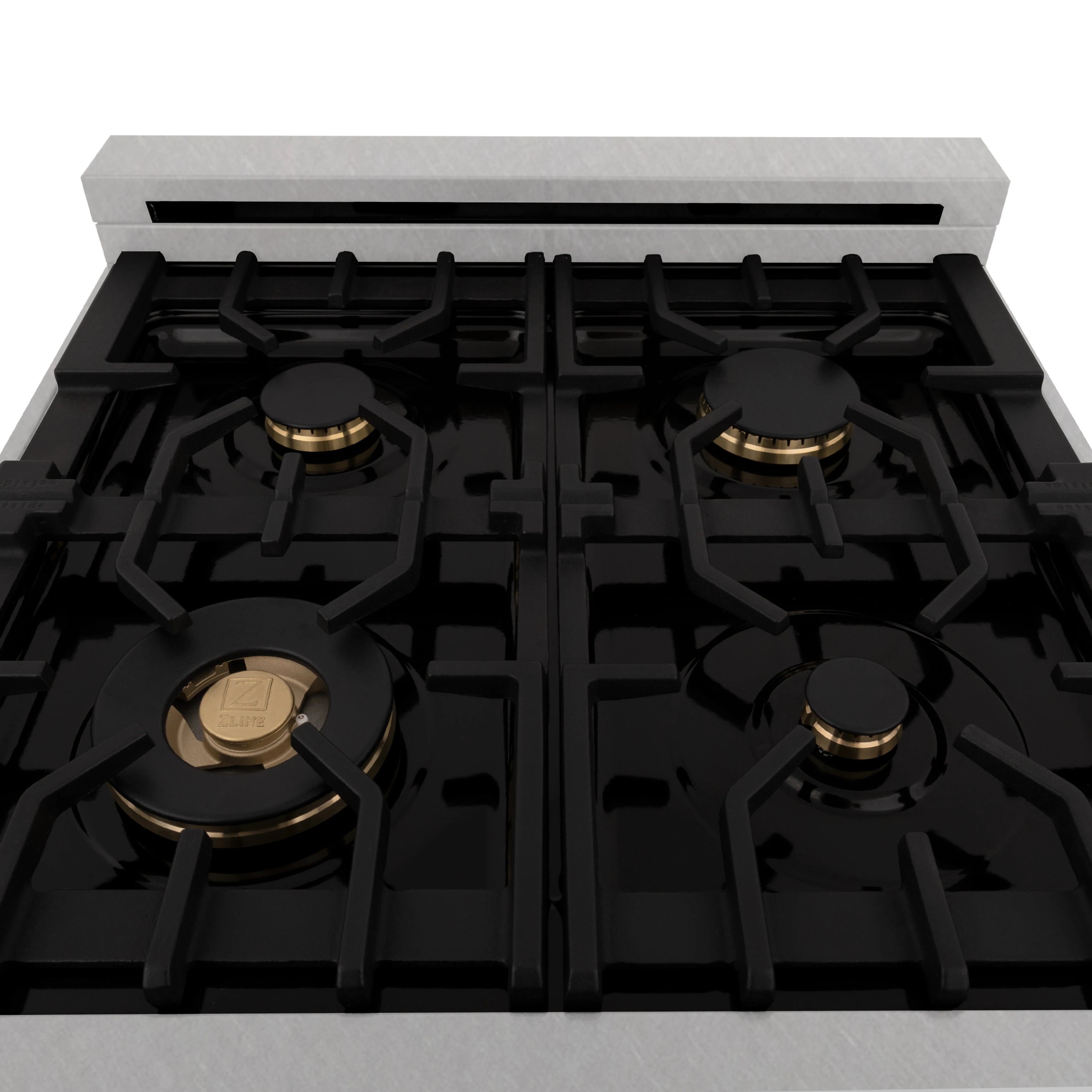 Cooktop view with four black gas burners, cast-iron grates, gold-trim caps