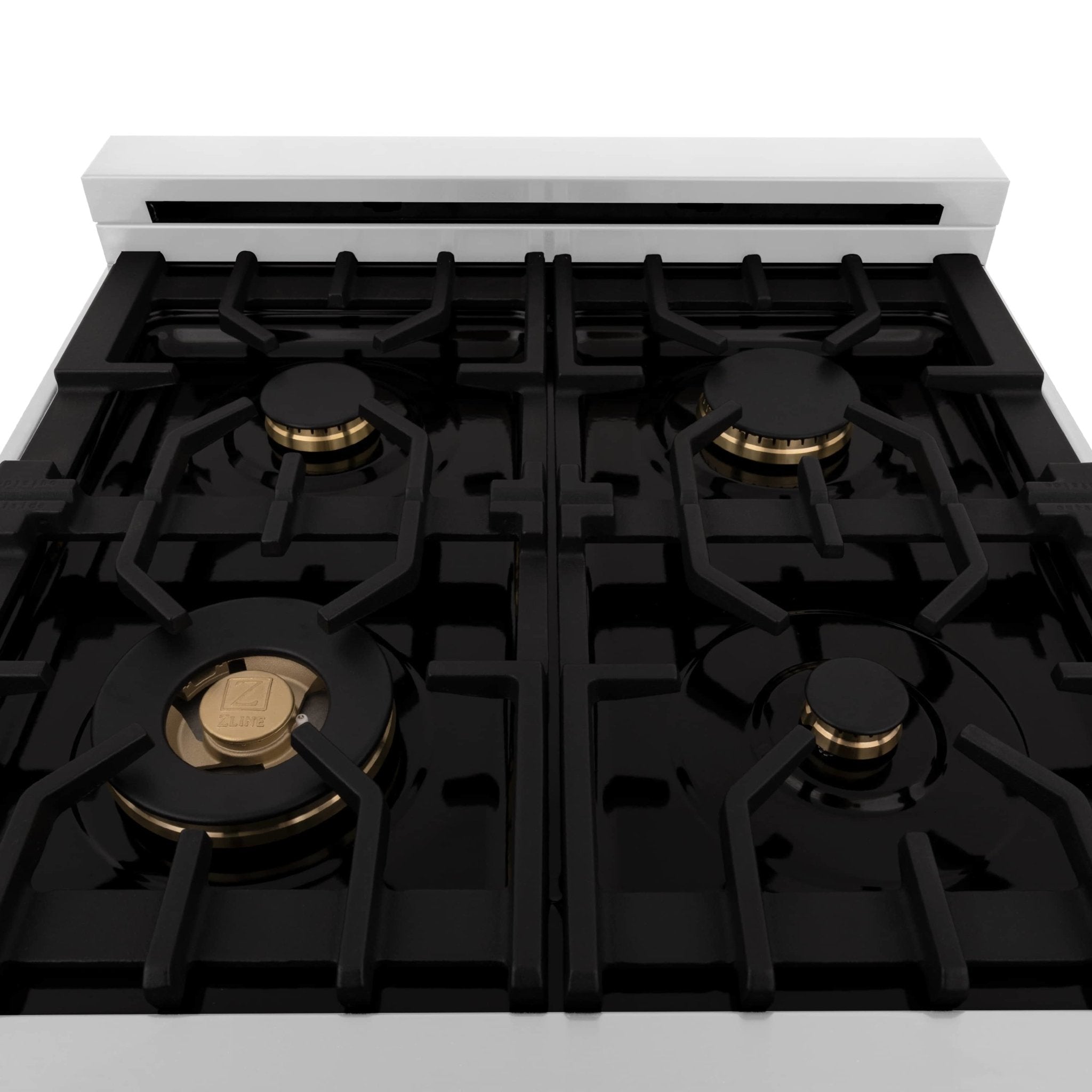Dual-fuel range cooktop with black grates and brass-toned burner heads