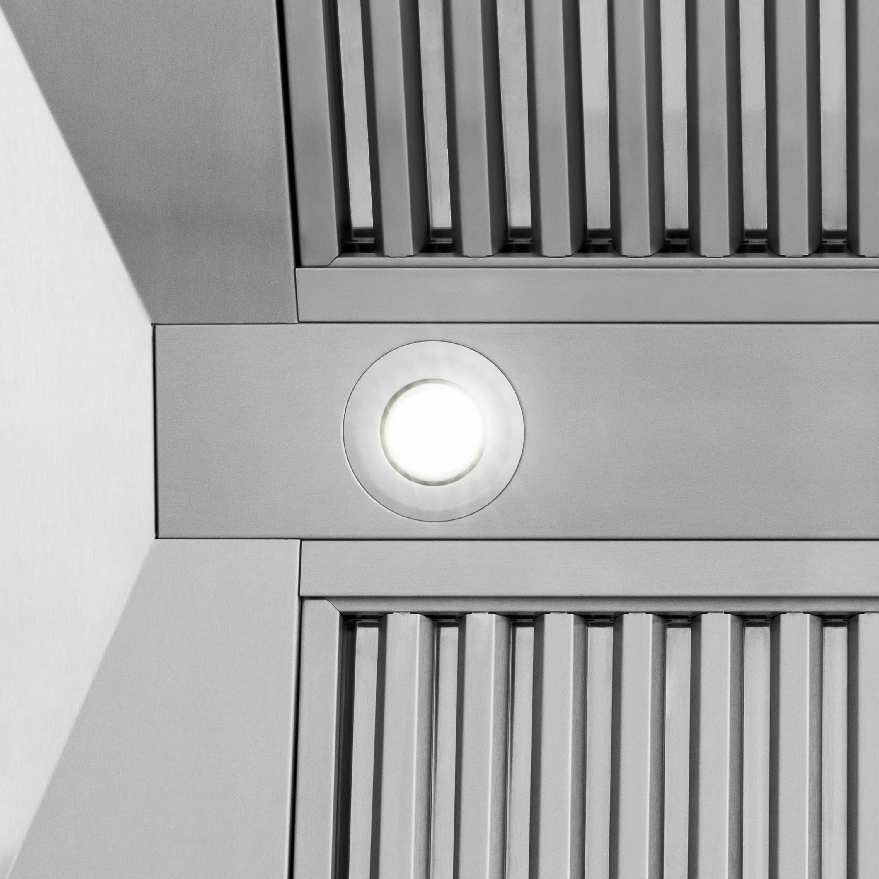 Stainless range hood control panel with round light and vertical vent grilles