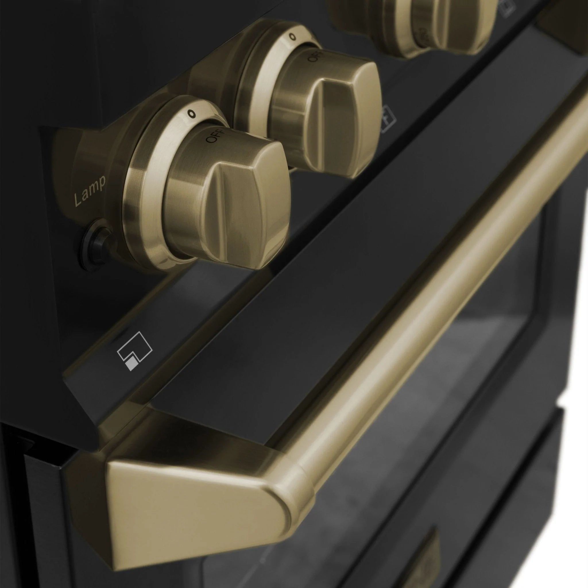 Dual fuel range control panel with champagne bronze knobs on a black face.