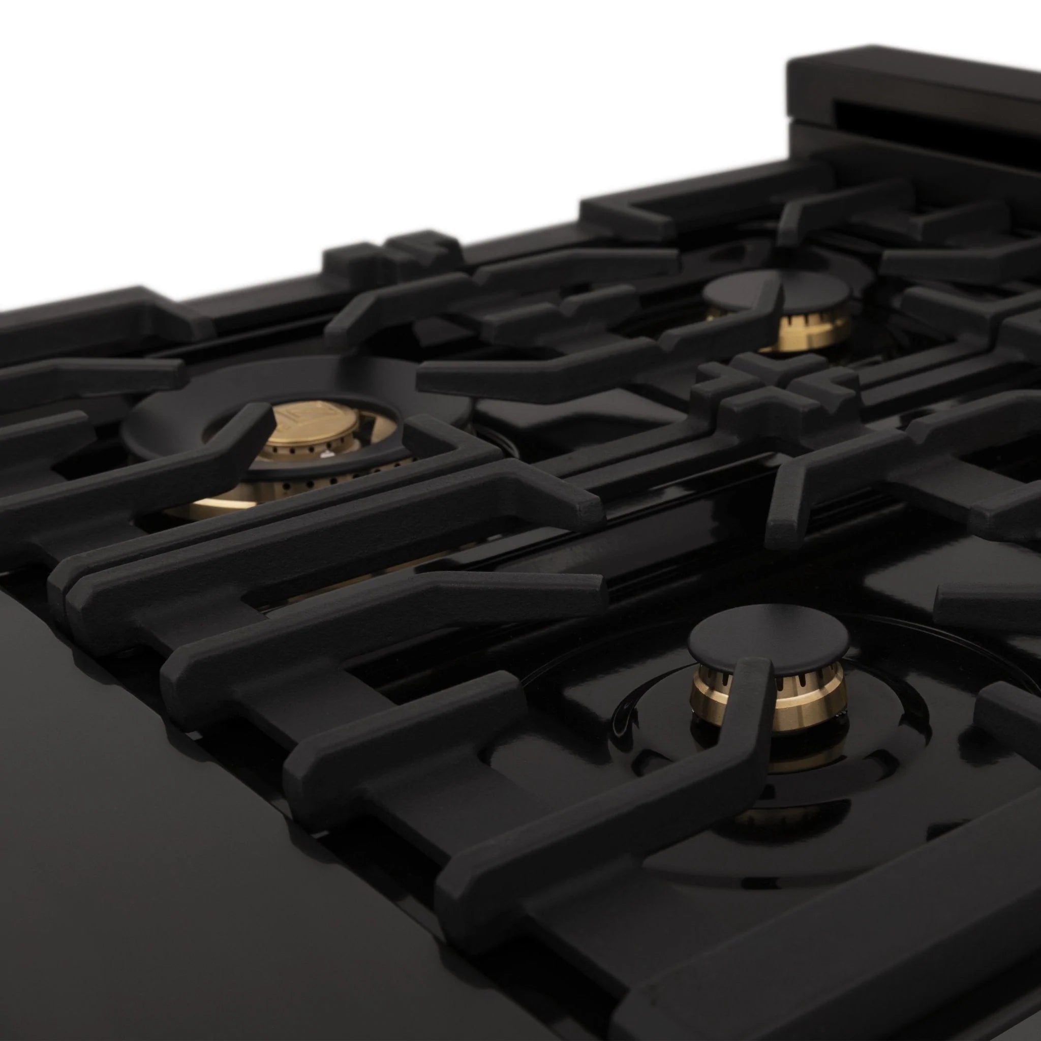 Black gas cooktop with grate and champagne bronze burner heads.