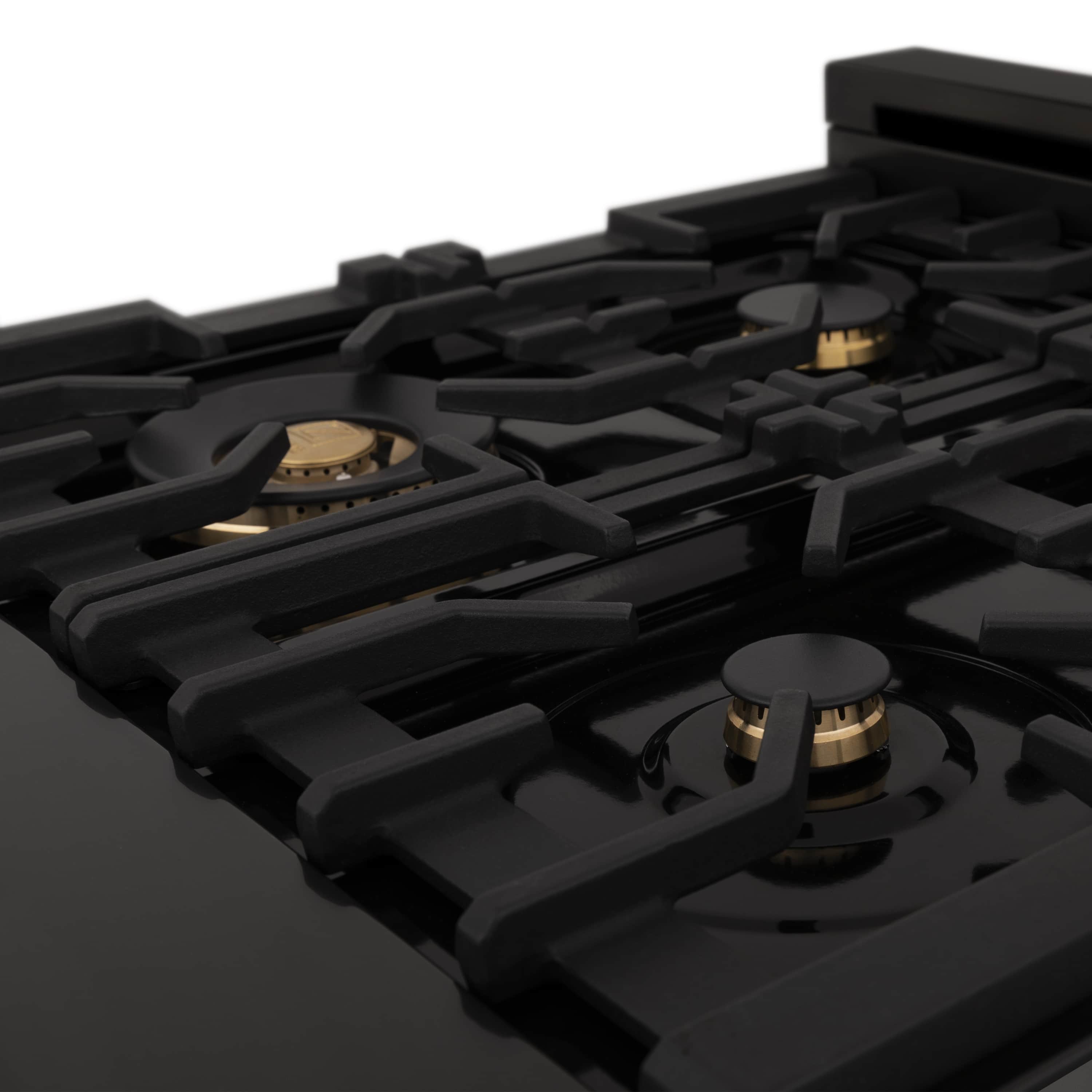 Black gas cooktop with black grates and gold-toned burner bases