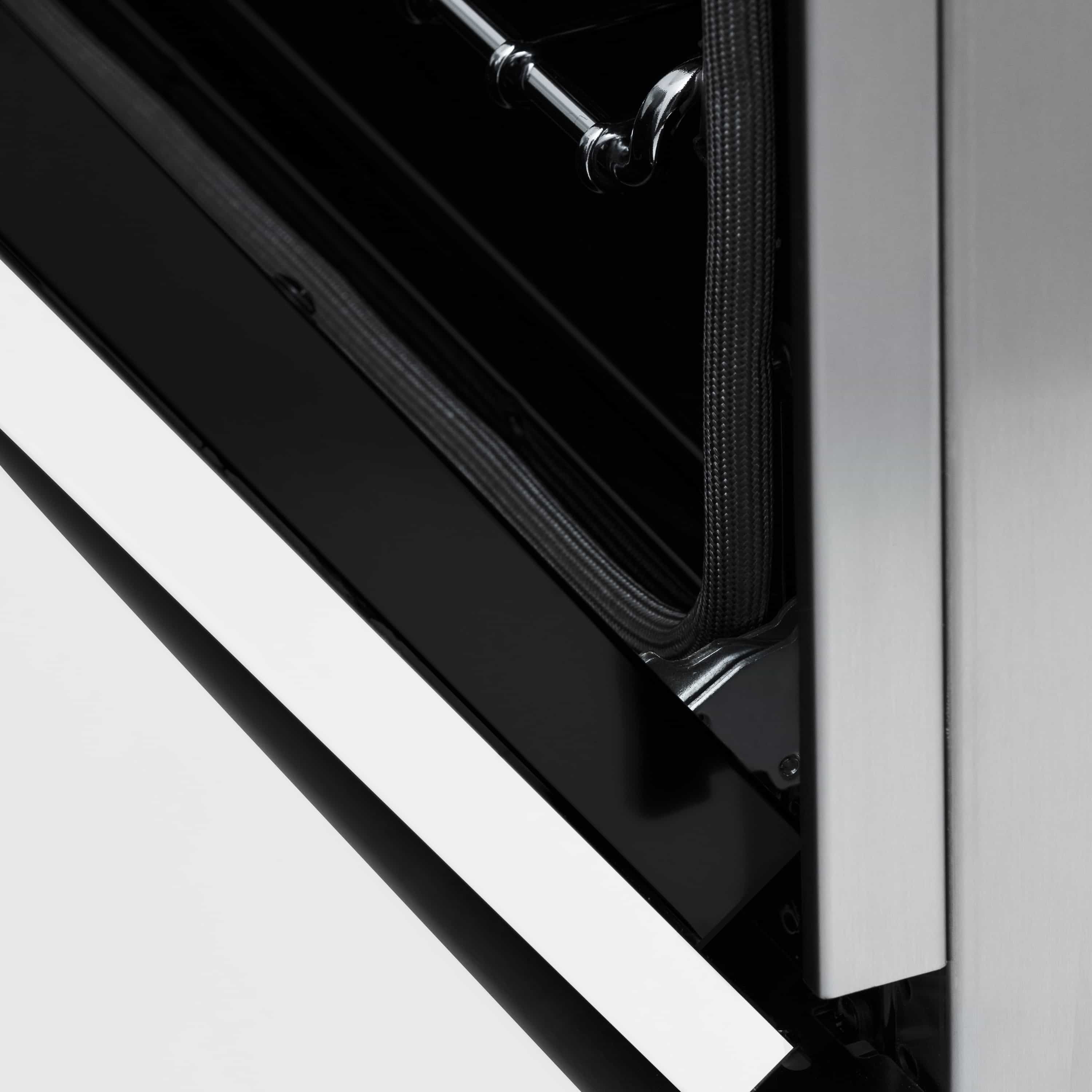 Dual fuel range oven door edge with black gasket seal and stainless frame