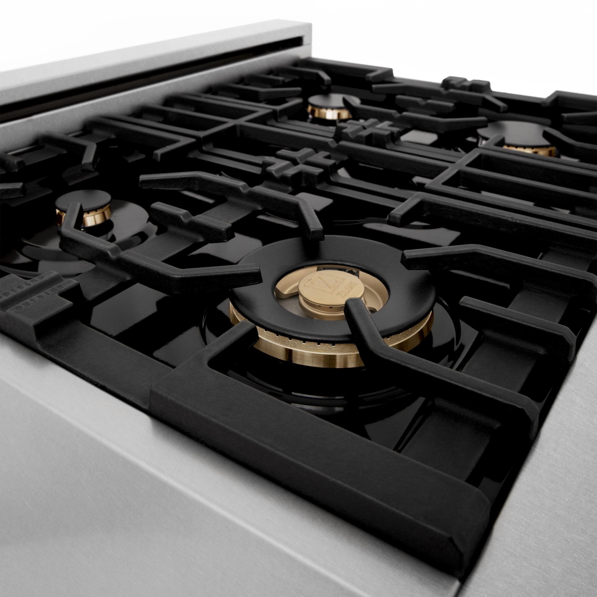 Dual fuel range gas cooktop with black grates and brass burner head