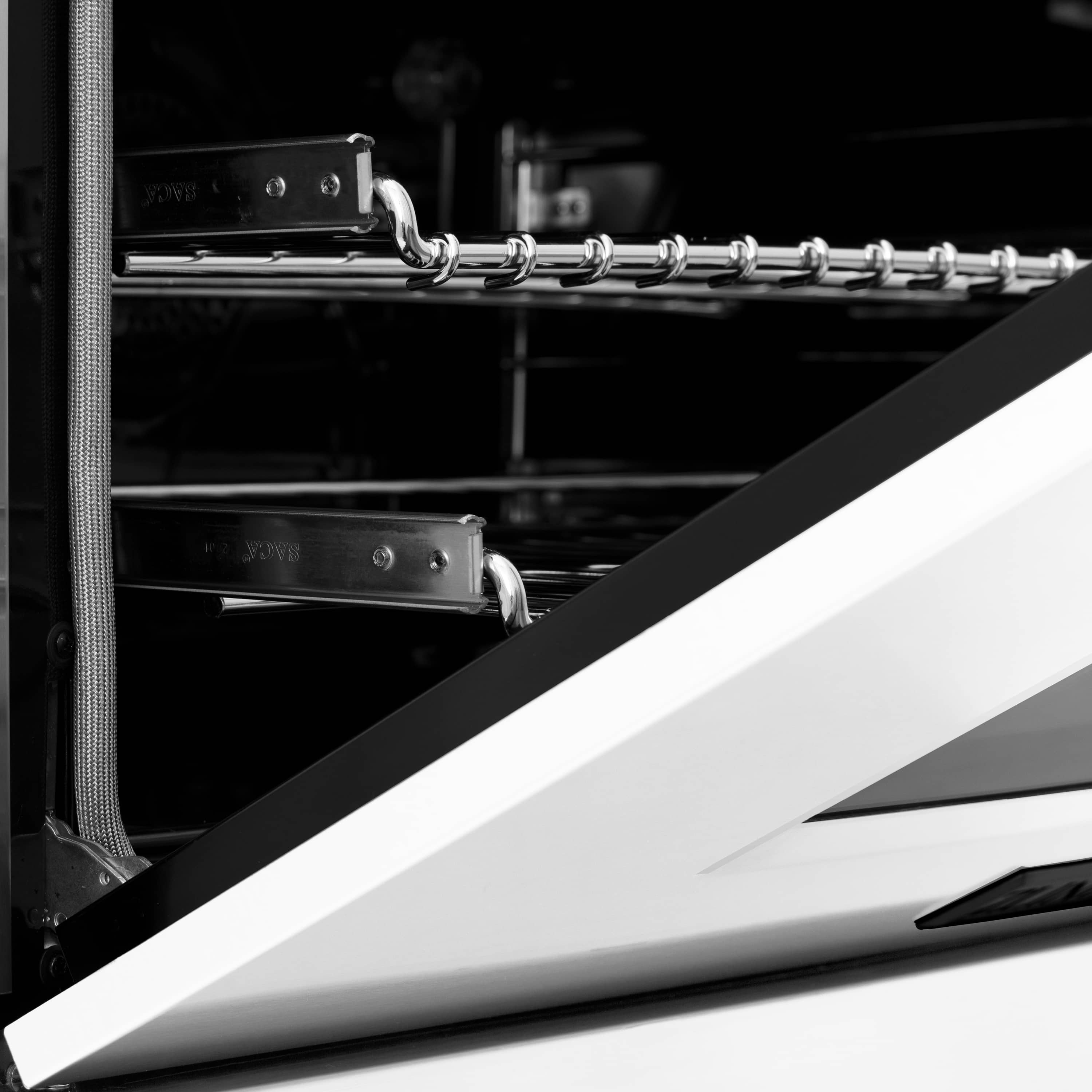 Oven interior view with metal broil rack and chrome rails