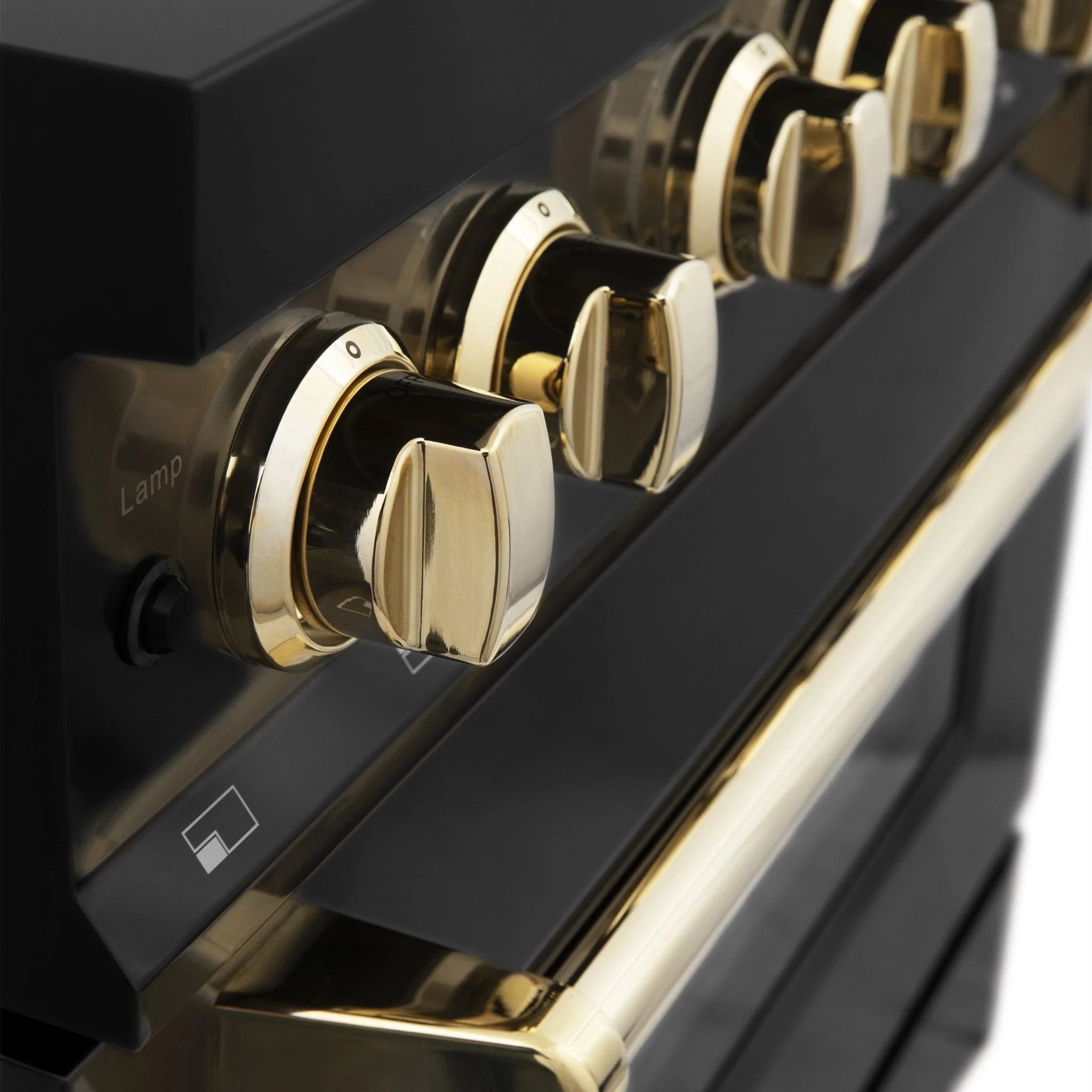 Gold-trim control knobs on a black dual-fuel range front panel.