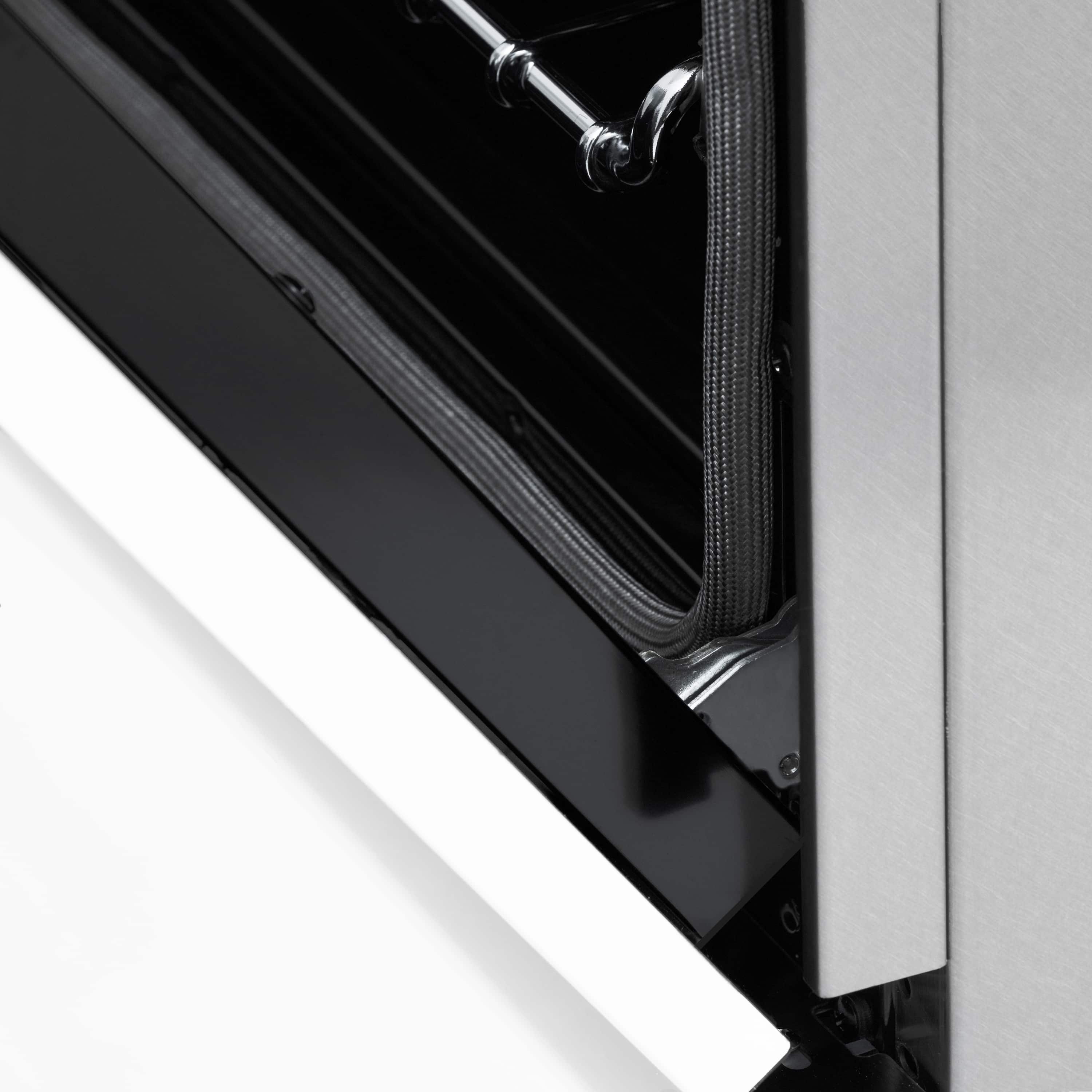 Stainless steel range control panel corner with dark trim and vented edge