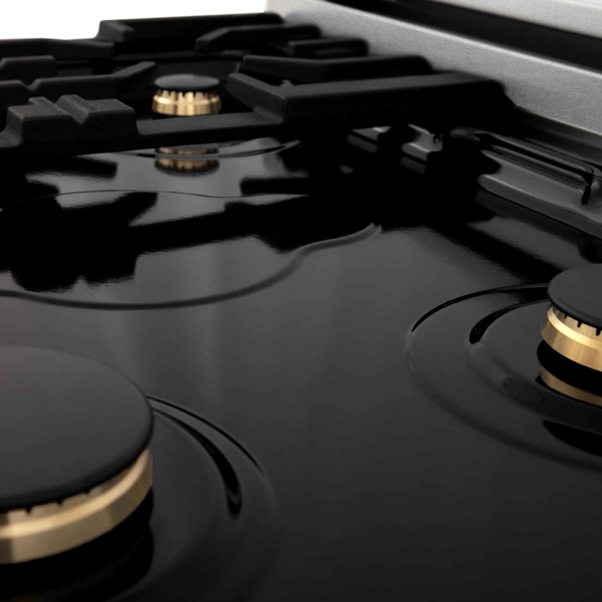 Dual fuel range cooktop with matte black burner caps and surrounding grates
