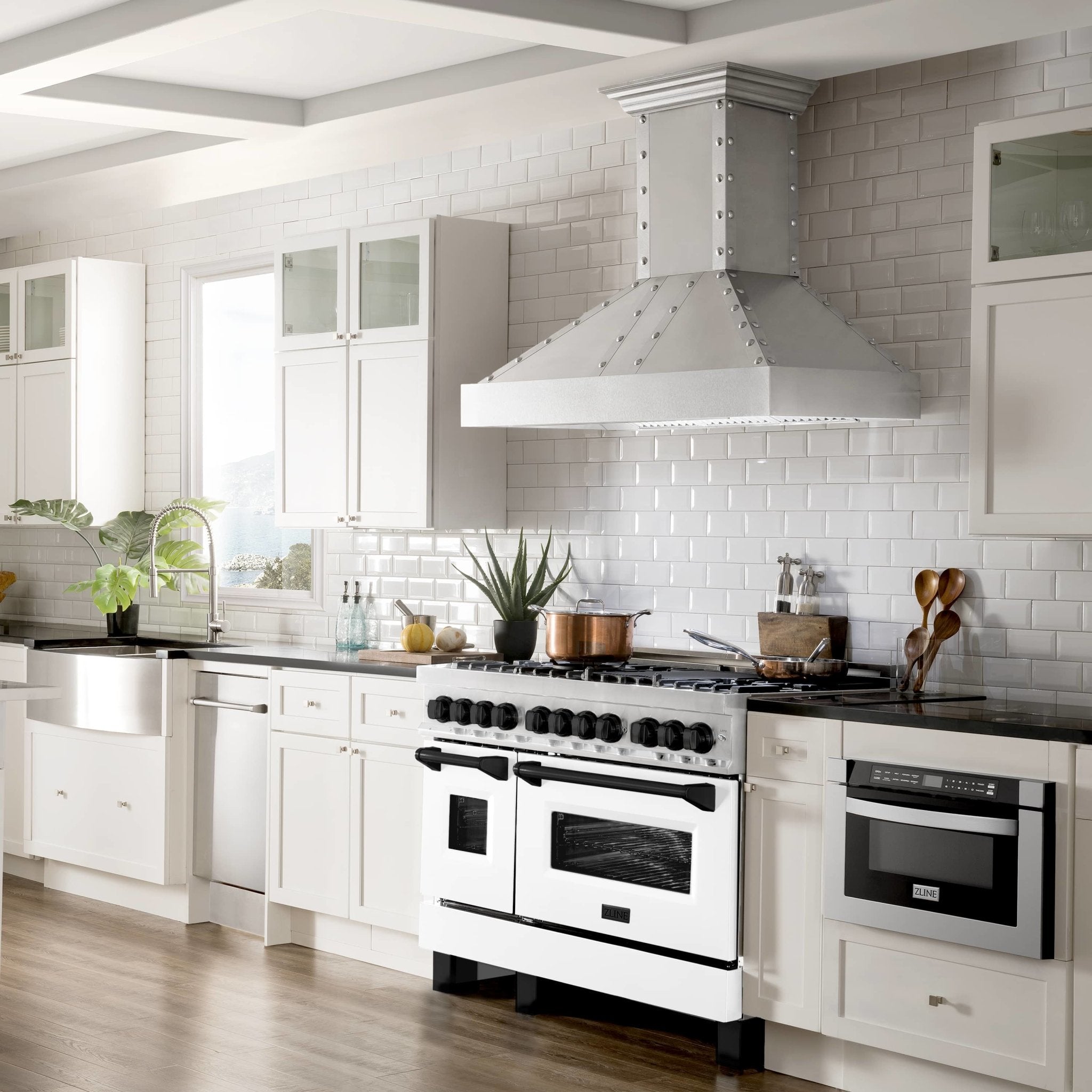 48-inch dual fuel range in white matte with black knobs, stainless trim, and burners