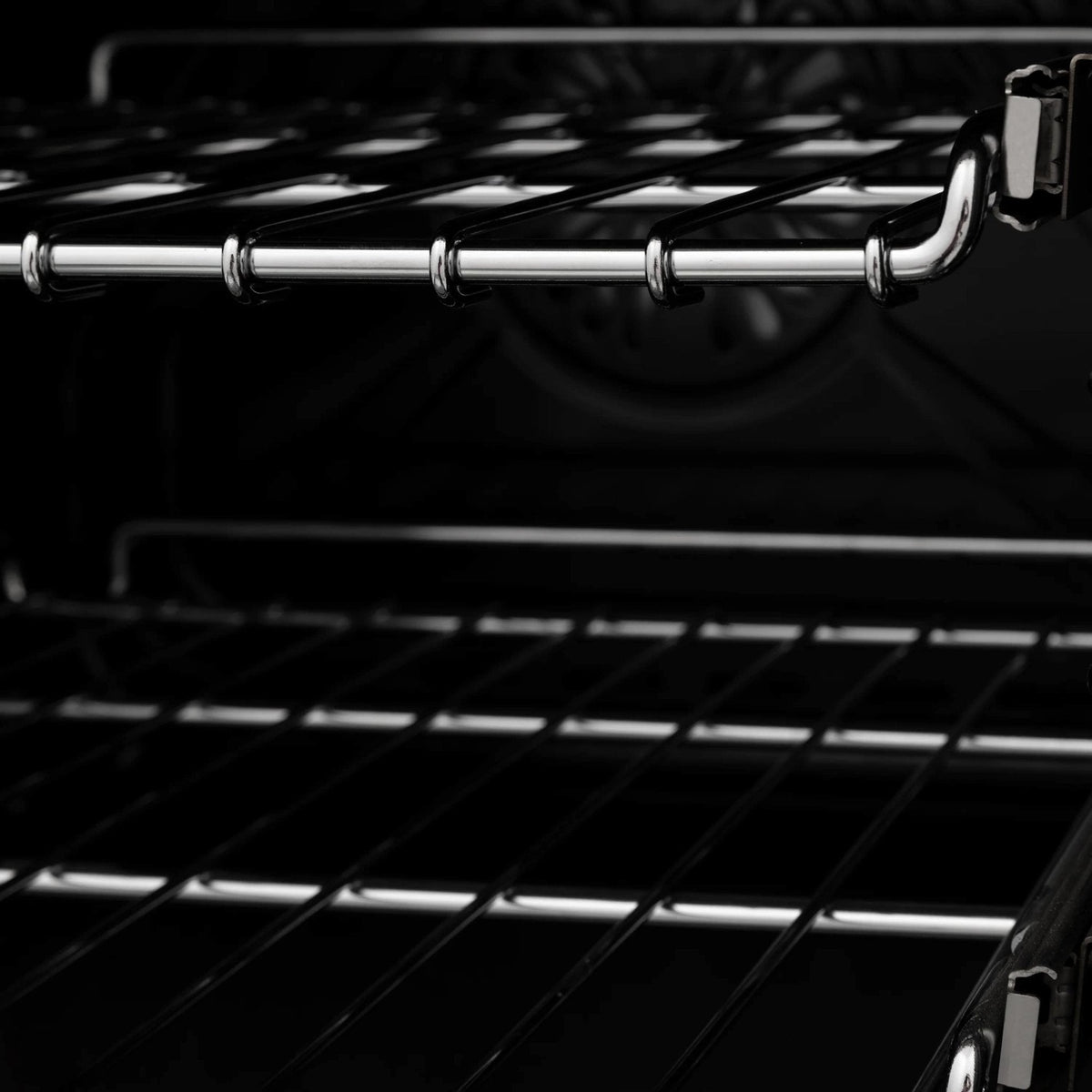 Oven interior rack with chrome rails and dark enamel cooking space