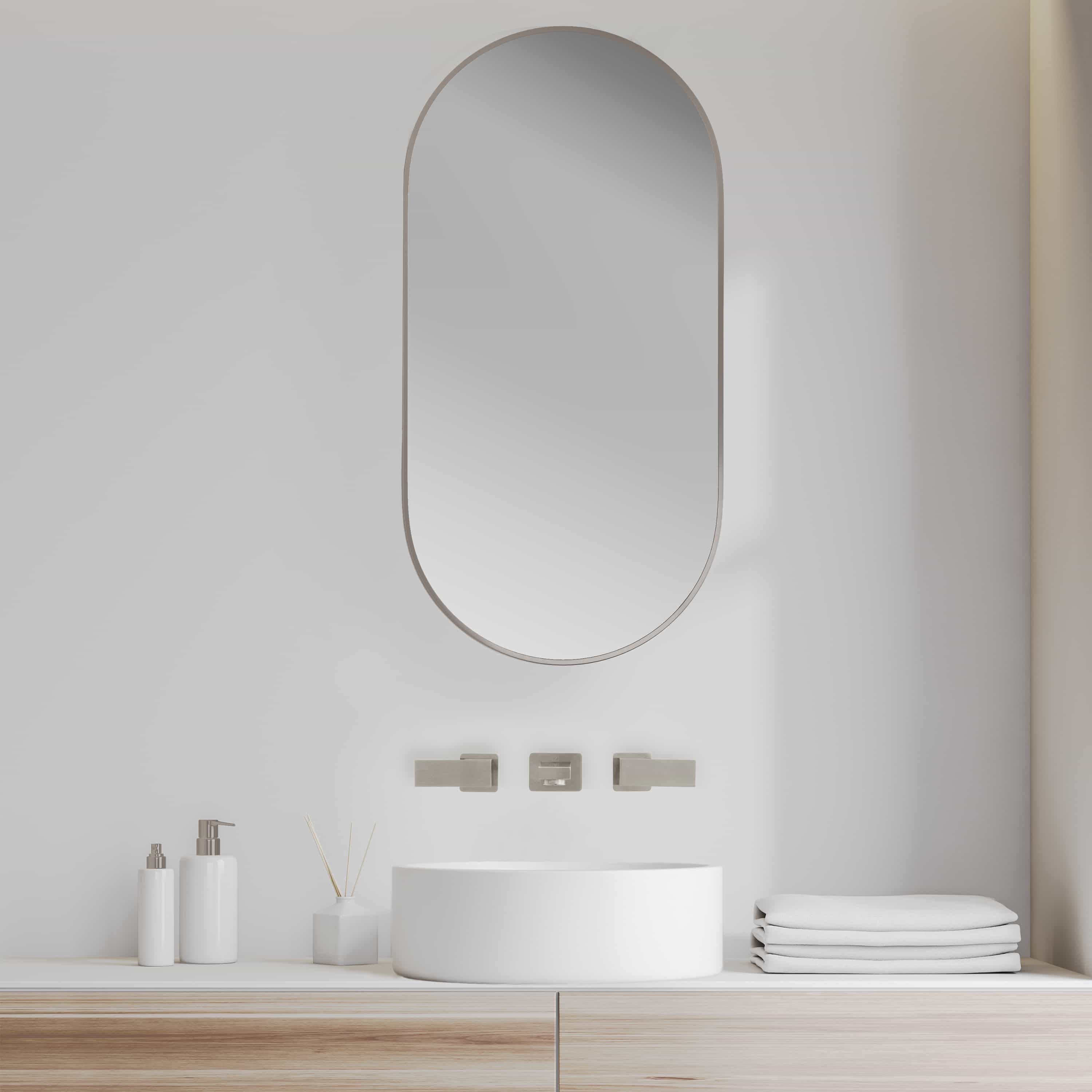Brushed nickel wall-mount bath faucet, long spout with minimal lever handles.