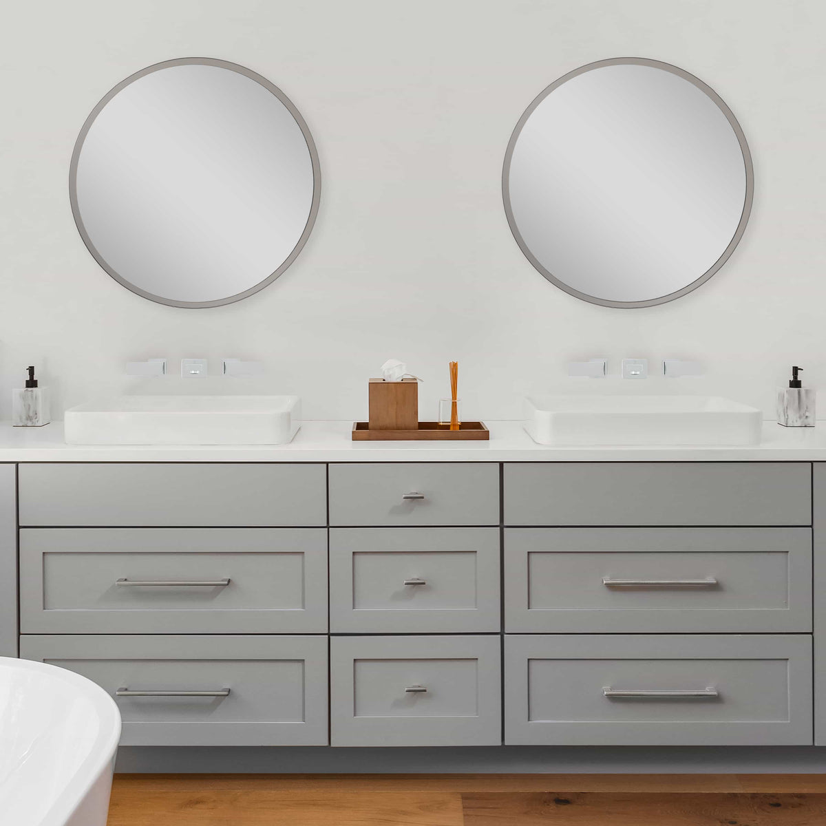 Two chrome wall-mount bathroom faucets with lever handles and matching spouts