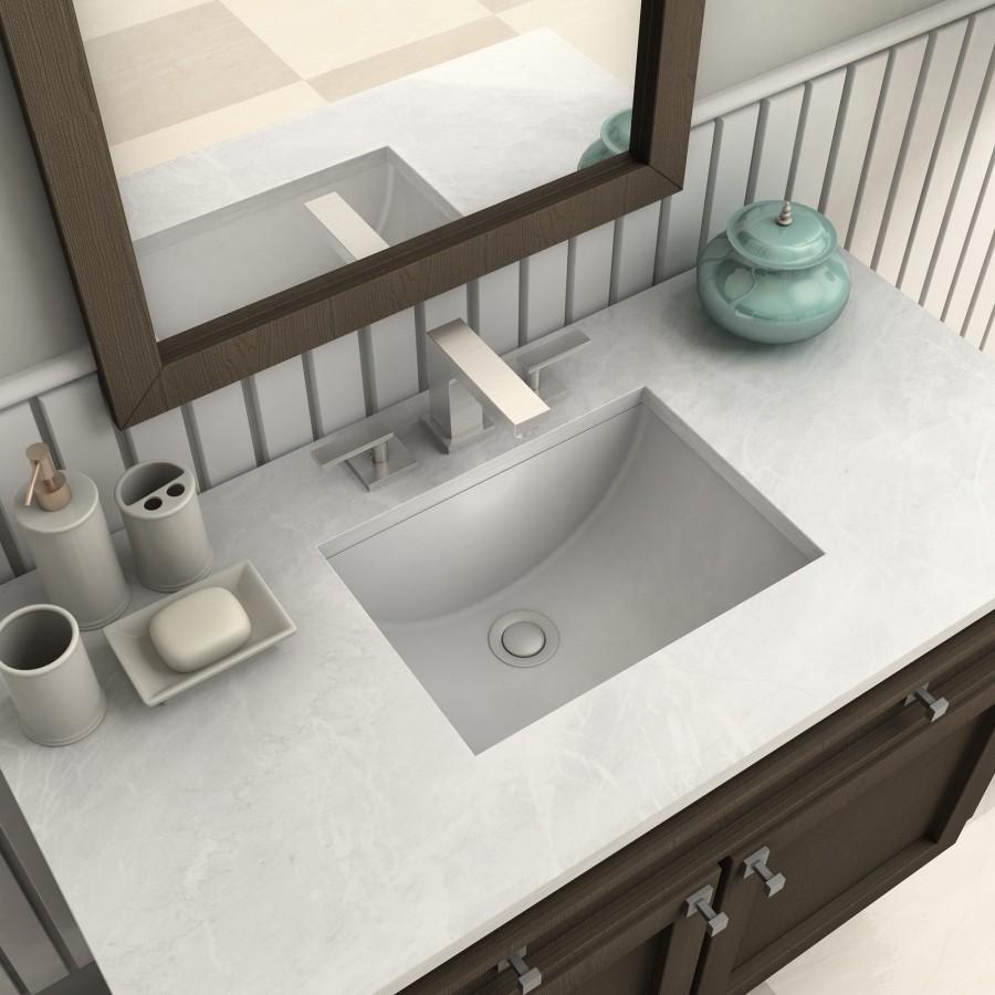 Brushed nickel widespread bath faucet with curved spout and two matching handles
