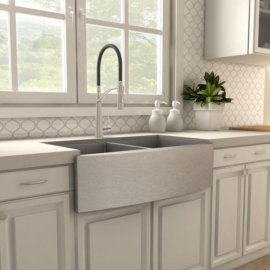 Brushed nickel kitchen faucet with tall arched spout over double sink