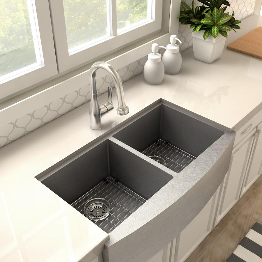 Brushed nickel kitchen faucet with curved spout above double-basin sink