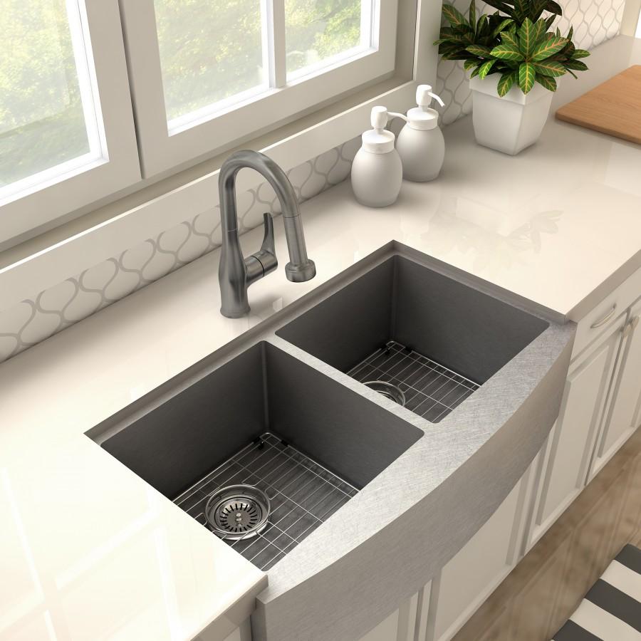 Gun metal kitchen faucet with tall curved spout over double sink