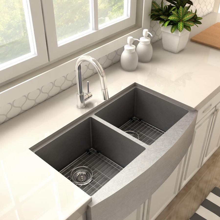 Chrome kitchen faucet with arched spout installed over double sink