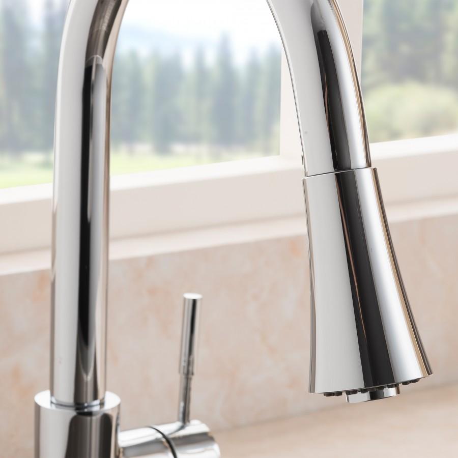 Chrome kitchen faucet close-up with curved spout and side handle