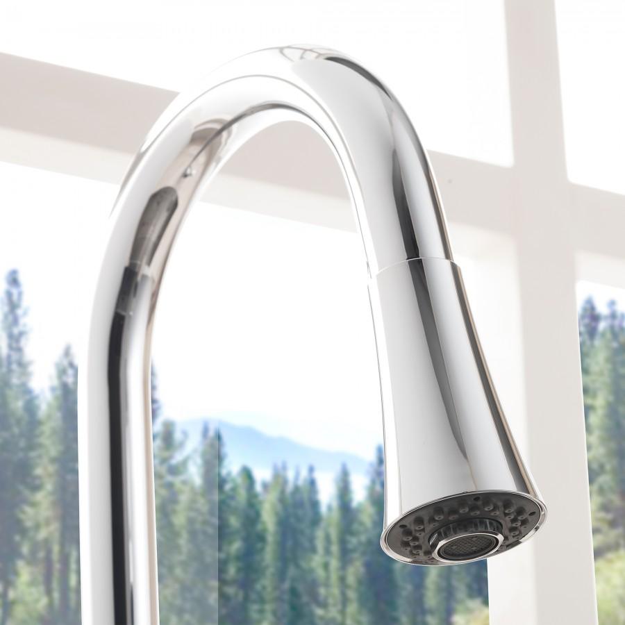 Close-up of chrome faucet spout with aerator head