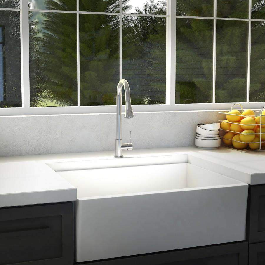 Chrome tall faucet with curved spout mounted on sink ledge