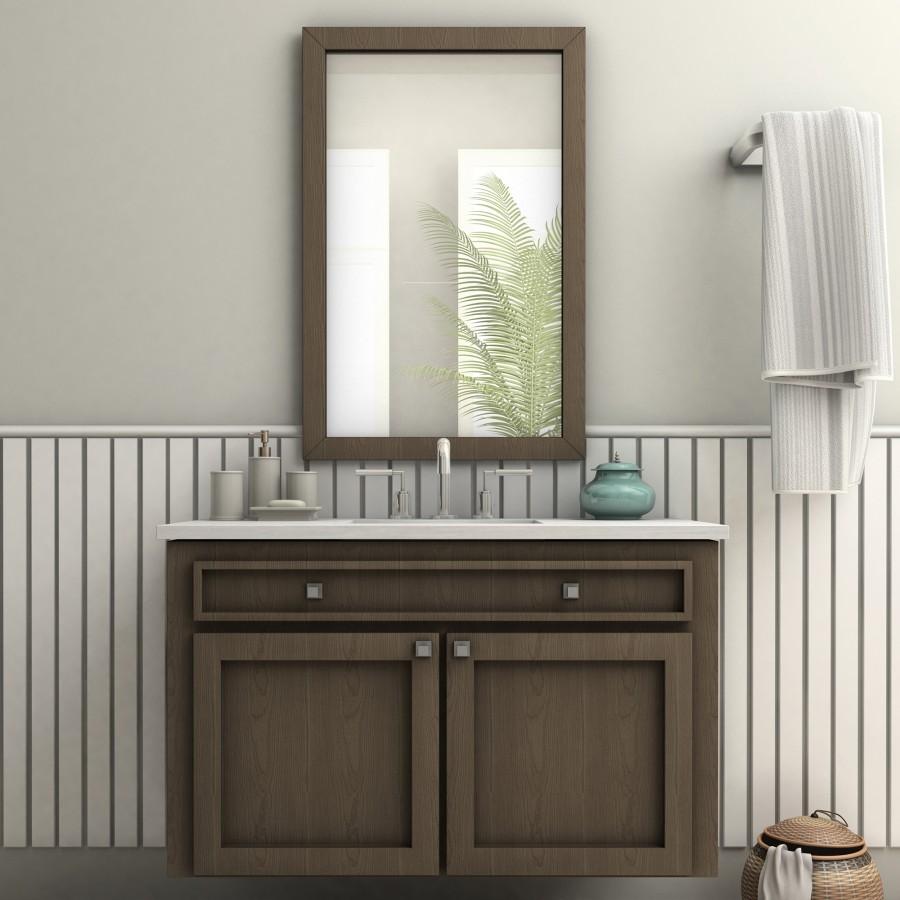 Chrome bath faucet with arched spout and two deck-mounted handles on vanity