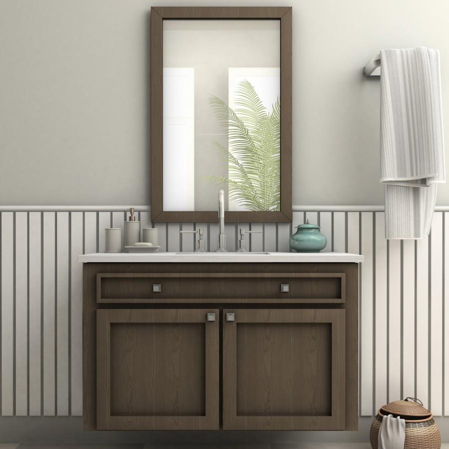 Chrome bath faucet and sink on a vanity with two lever handles and arched spout.