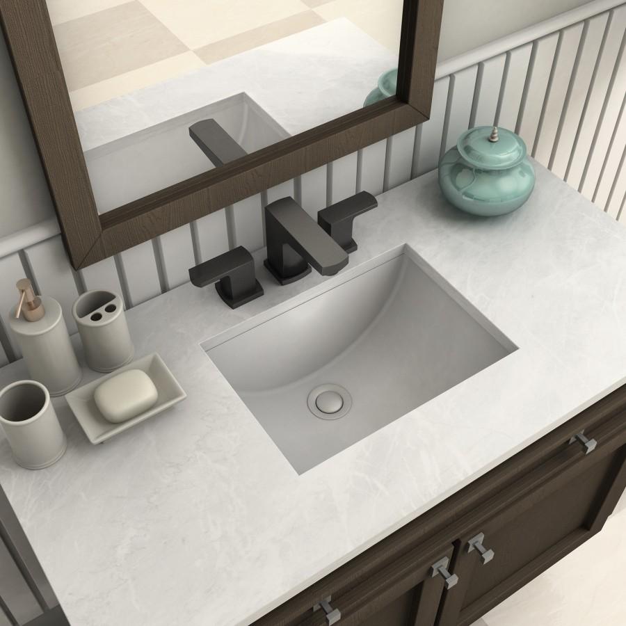 Matte black bath faucet with arched spout and two deck-mounted handles on sink