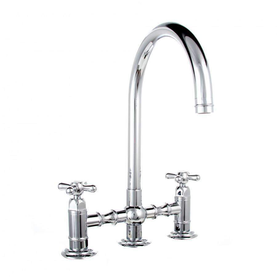 Chrome kitchen faucet with tall arched spout and cross handles on deck mount
